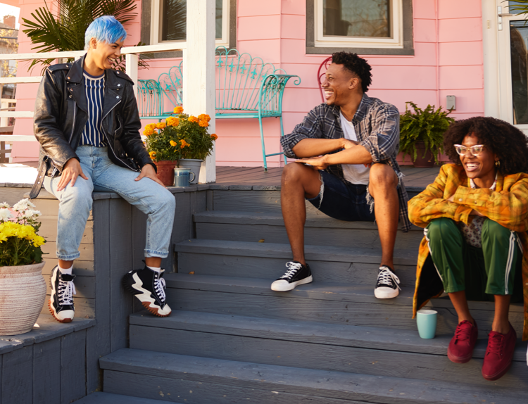 Group of friends sitting outside on porch