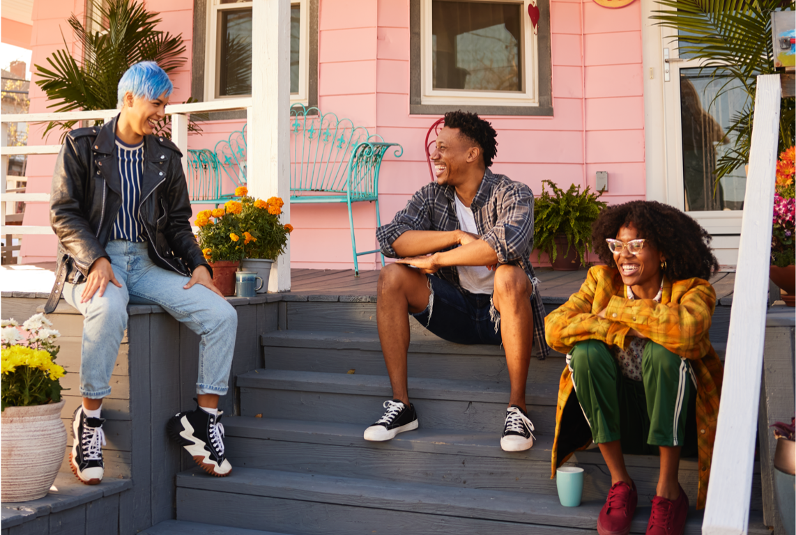 Group of friends sitting outside on porch