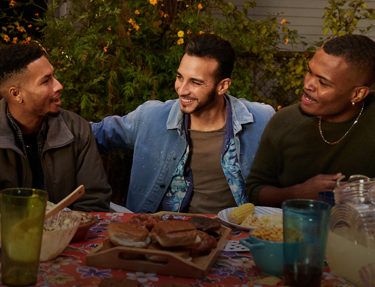 Group of men at cookout laughing together