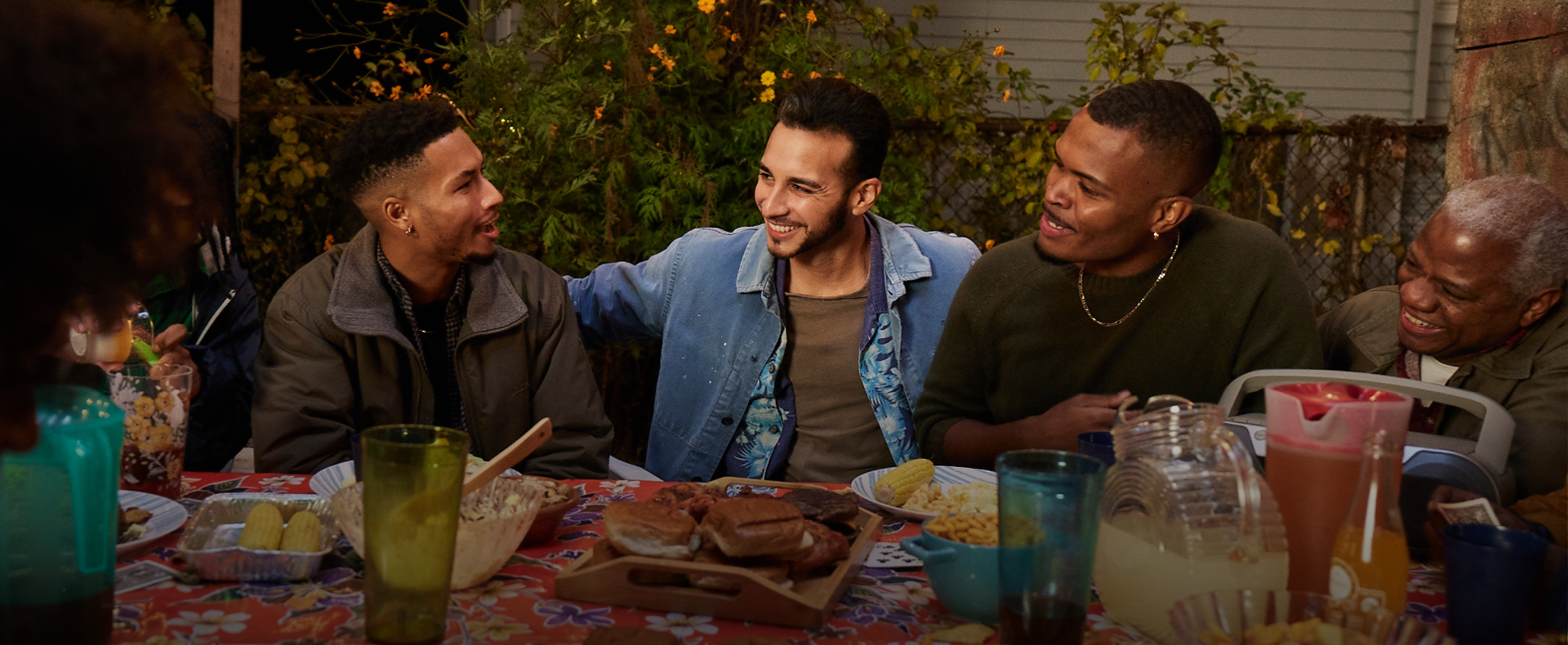 Group of men at cookout laughing together